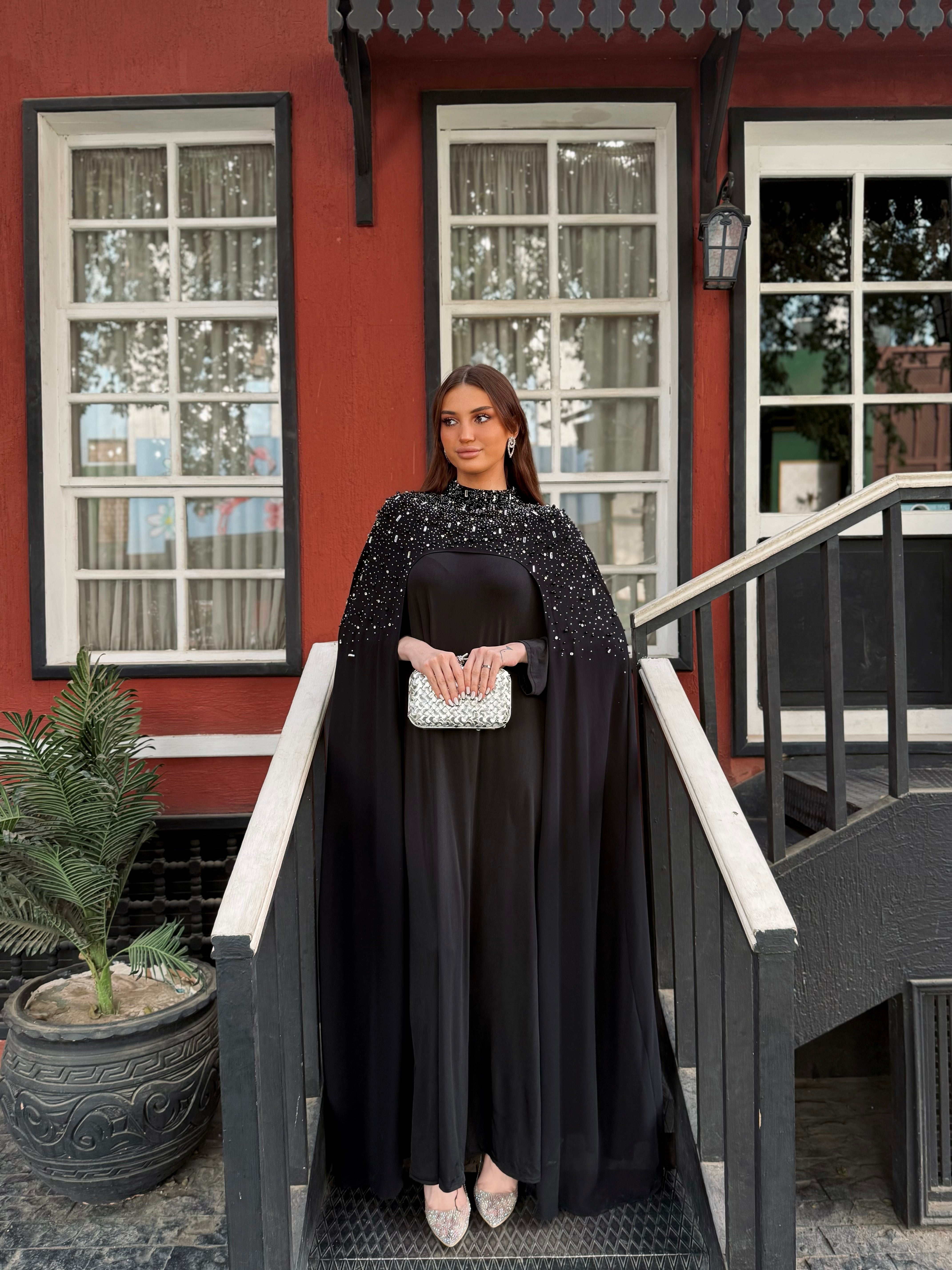 Midnight Sunburst Cape Gown